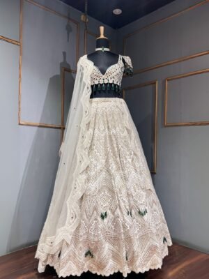 Thread embroidery lehenga with pearls and embroidery detailing.