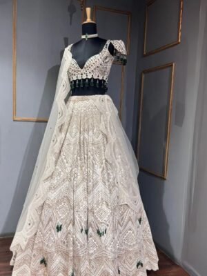 Thread embroidery lehenga with pearls and embroidery detailing.